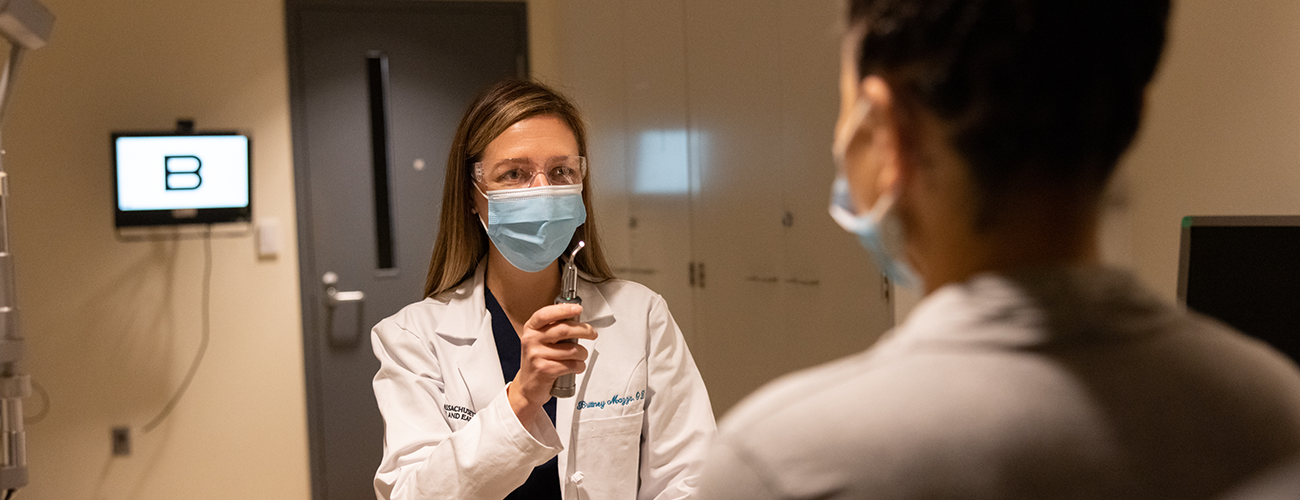 Mass Eye and Ear eye doctor performs an eye test on a patient