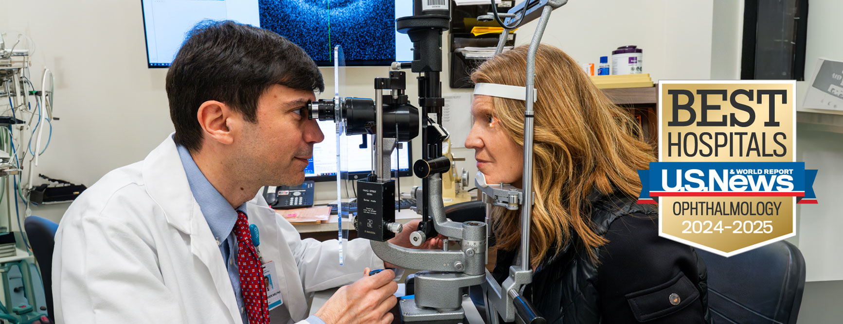 Mass Eye and Ear doctor performing eye exam on patient