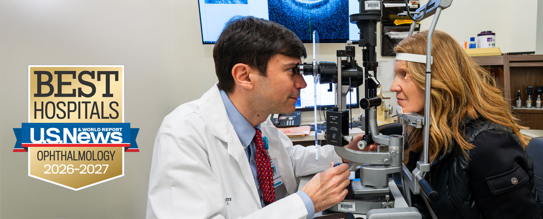 Mass Eye and Ear doctor performing eye exam on patient