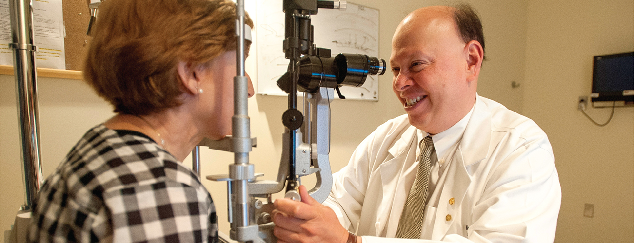 Mass Eye and Ear eye doctor examines a patient
