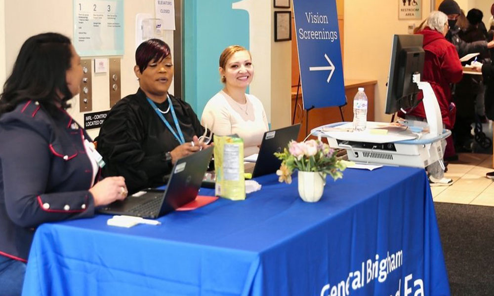 Mass Eye and Ear staff at the welcome table for the screening event