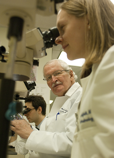 Fred Jacobiek in lab with researchers
