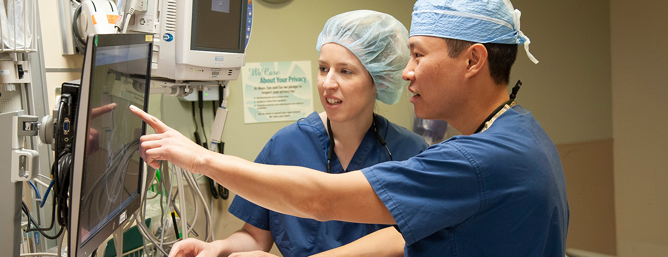 Mass. Eye and Ear clinicians view a patient case at a computer 