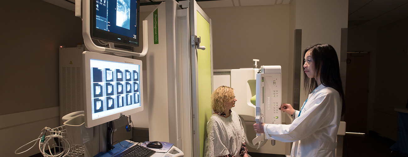 radiologist performing an x-ray and fluoroscopic exam on a patient