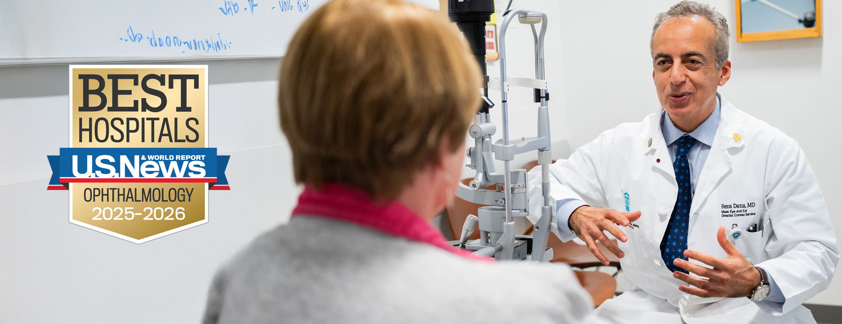 Mass Eye and Ear doctor performing eye exam on patient